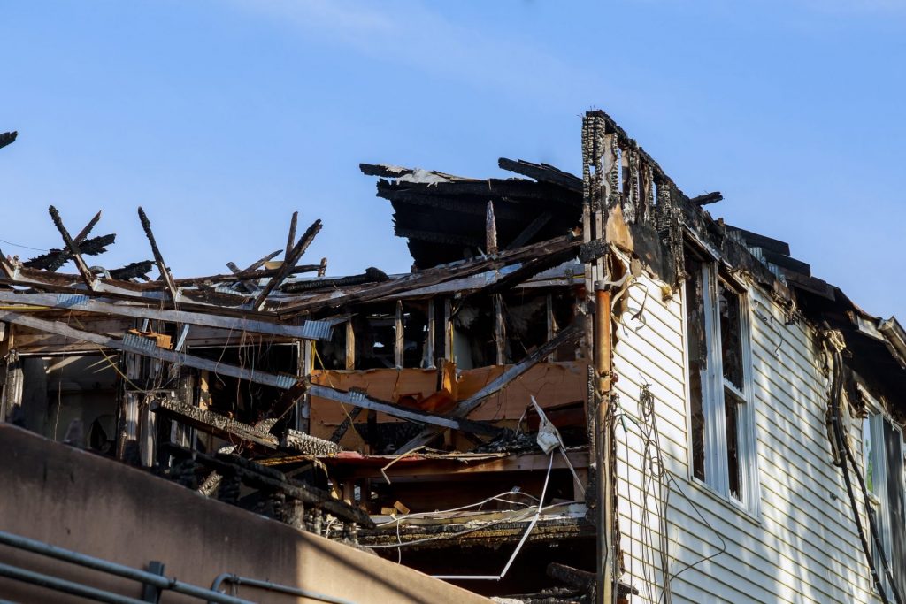 Ruins of house after big disaster - fire day the fire House in the city