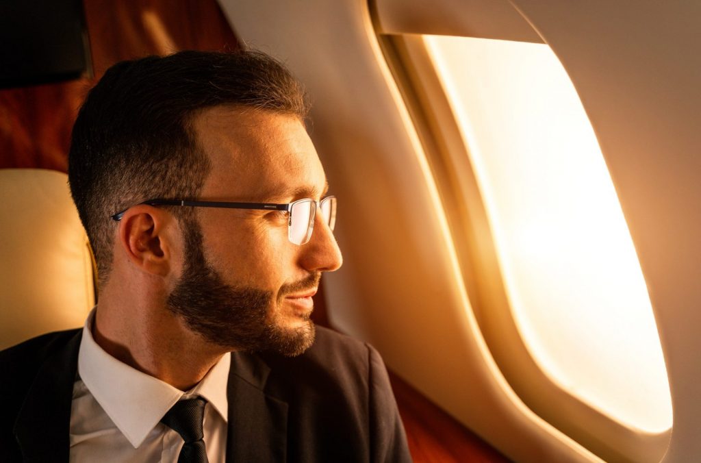 Businessman flying on private jet